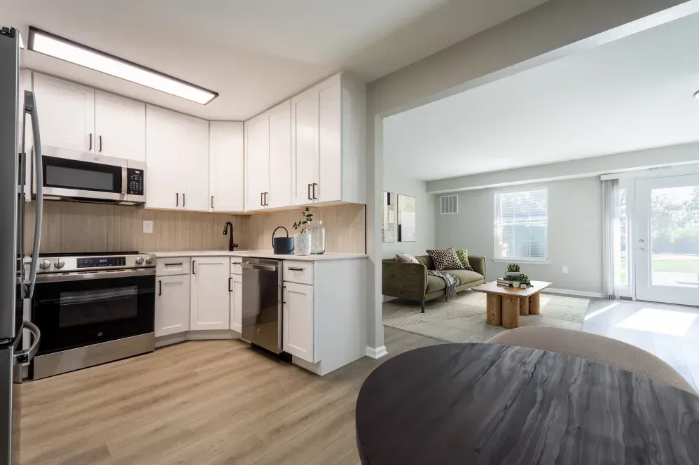 Open-concept kitchen and living area in a modern apartment. Visit us at Fox Ridge Apartments and view our apartments for rent in Limerick, PA.
