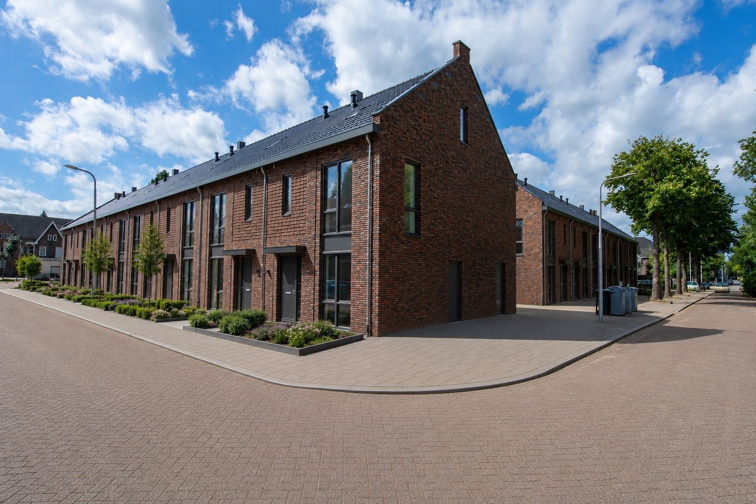 Een artist's impression van een rij bakstenen huizen naast een hek.