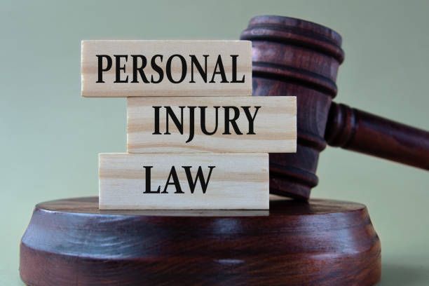 PERSONAL INJURY LAW | Wooden blocks with words, judge's gavel background | Green Bay, WI