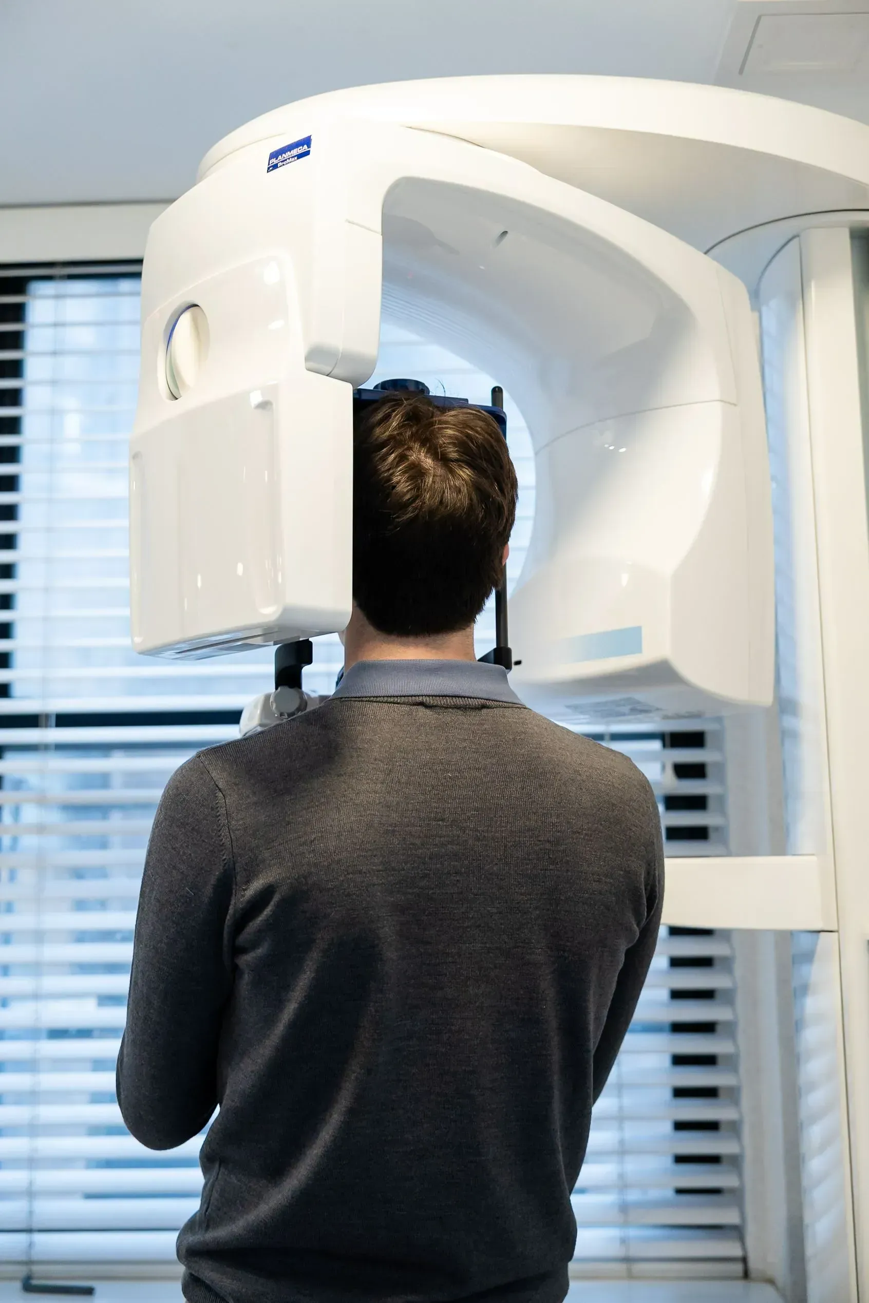A patient positioned in the office’s 3D scanner