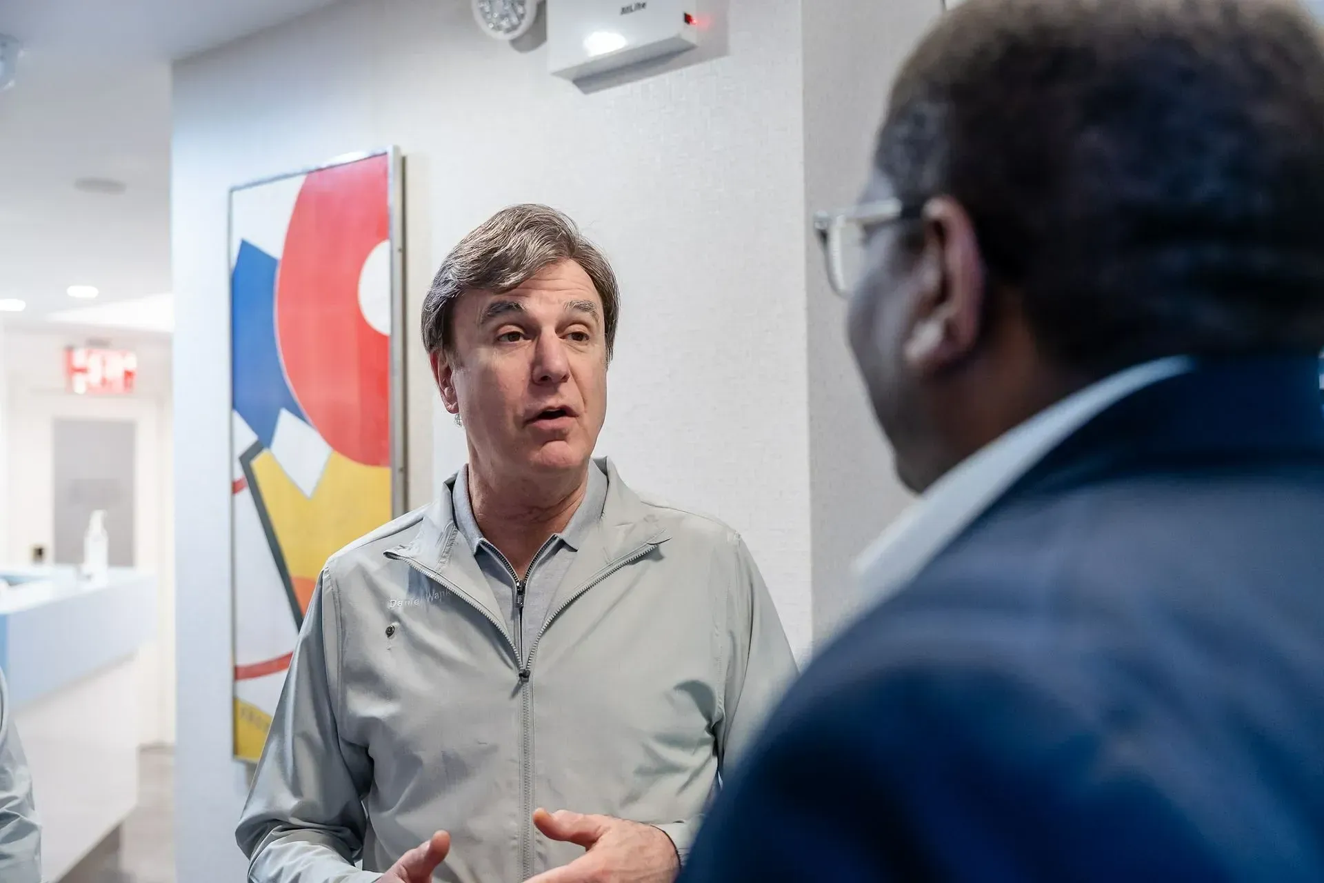 Dr. Daniel Wank talking with a patient about treatment