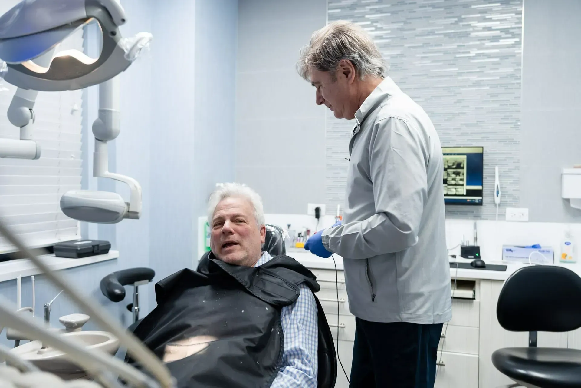 Dr. Daniel Wank with a patient in the dental chair