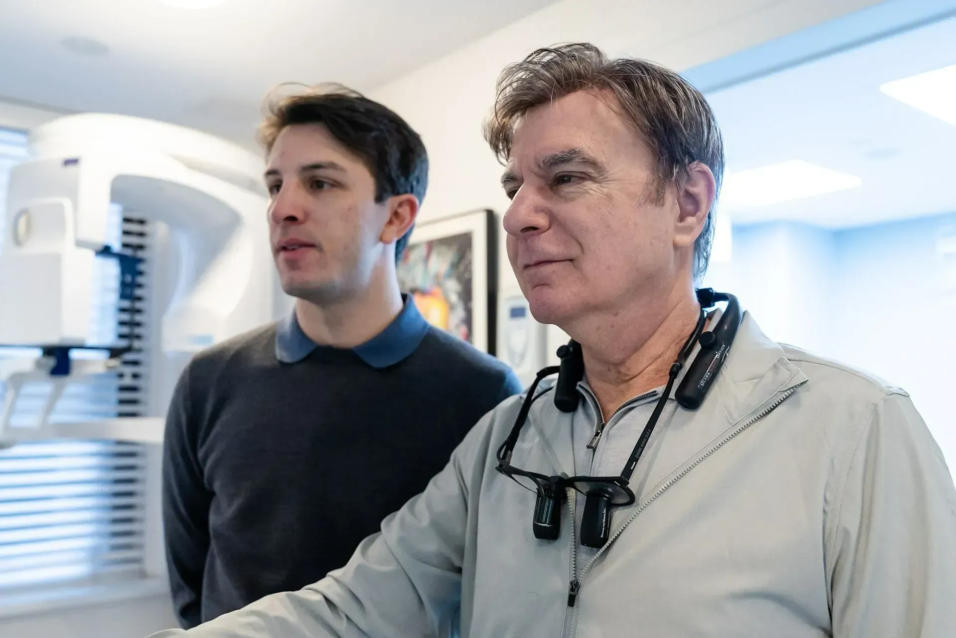 Dr. Daniel Wank reviewing a scan on screen with a patient