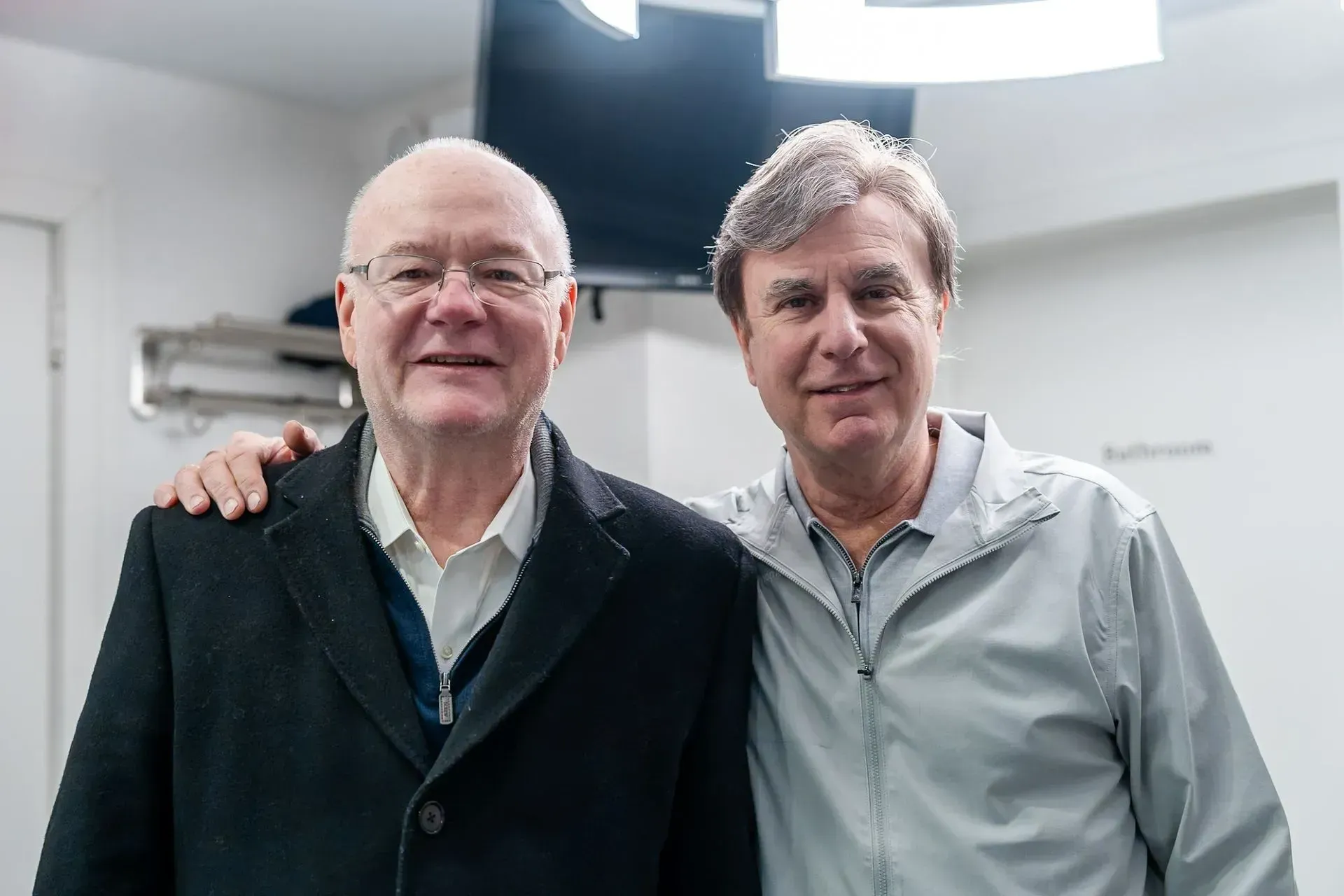 Dr. Daniel Wank with a smiling patient at the office