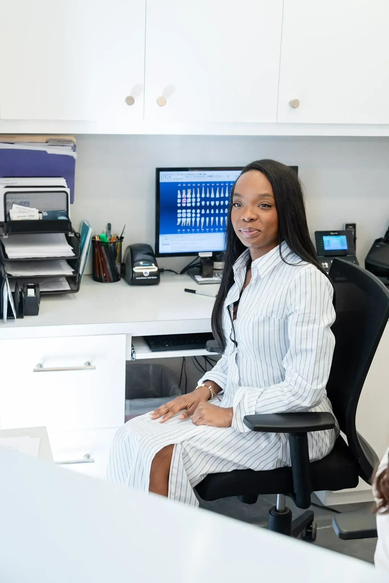 A front desk team member at the check-in desk