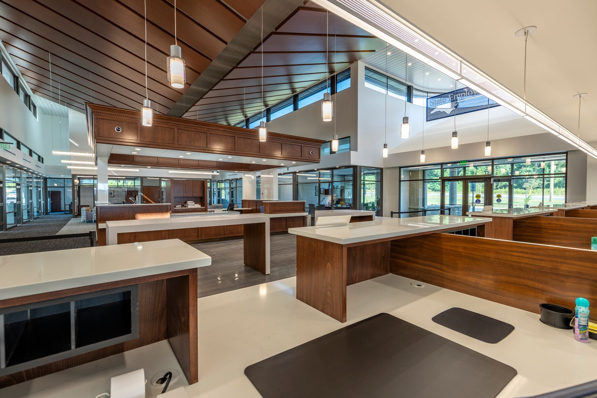 A large room with a lot of windows and tables.