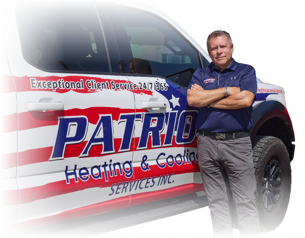 Man standing beside Patriot Heating & Cooling service truck with red, white, and blue American flag design
