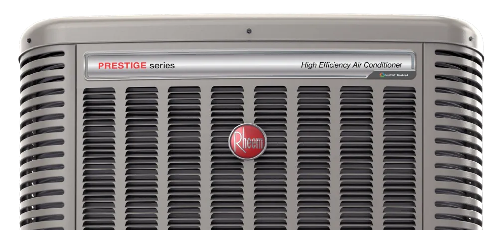 Front view of a silver vintage appliance with black vents and a red circular logo