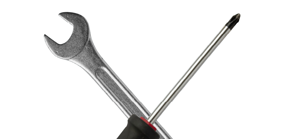 Crossed wrench and screwdriver on a white background