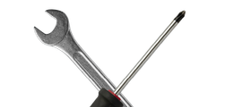 Crossed wrench and screwdriver on a white background