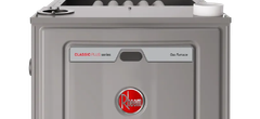 Front view of a gray Rheem gas furnace with red logo and control panel
