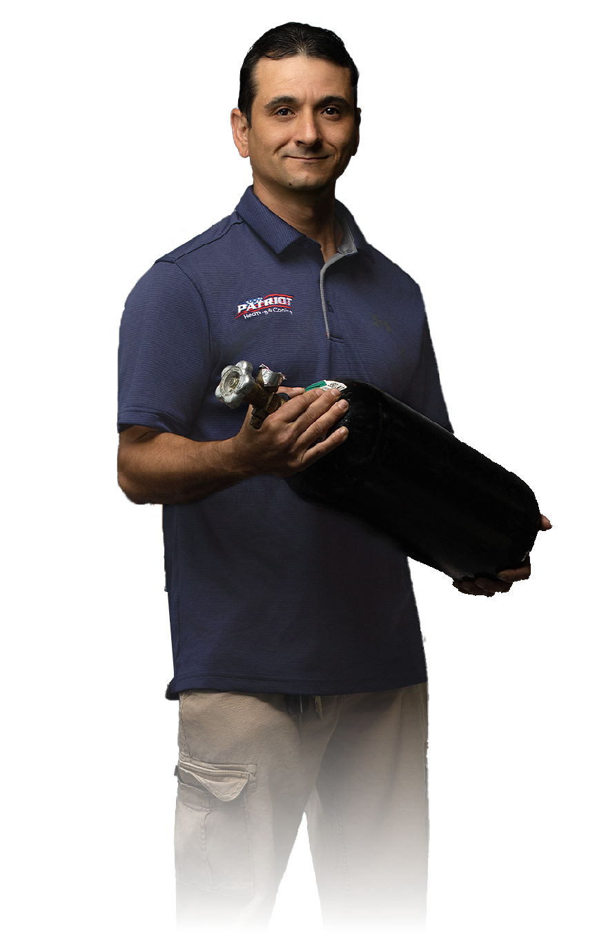 Man holding a black portfolio and a small model airplane, wearing a navy polo shirt against a white background