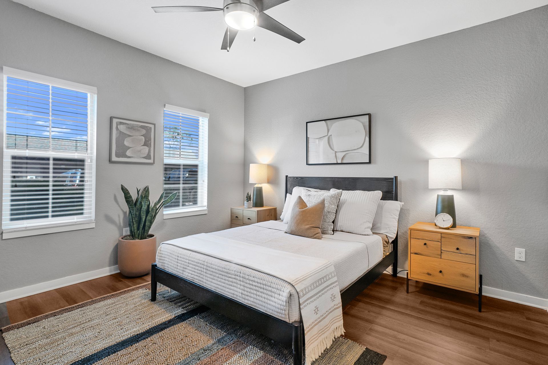 cozy bedroom with ceiling fan at Creekside Ranch Apartments in Bradenton