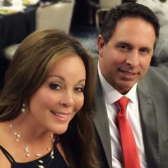 A man and a woman are posing for a picture together