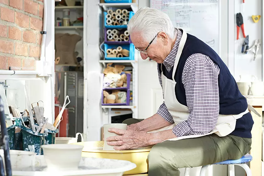 A senior doing pottery