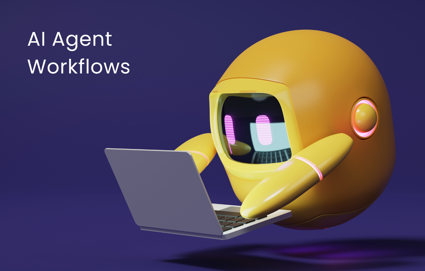 A yellow robot is using a laptop computer.