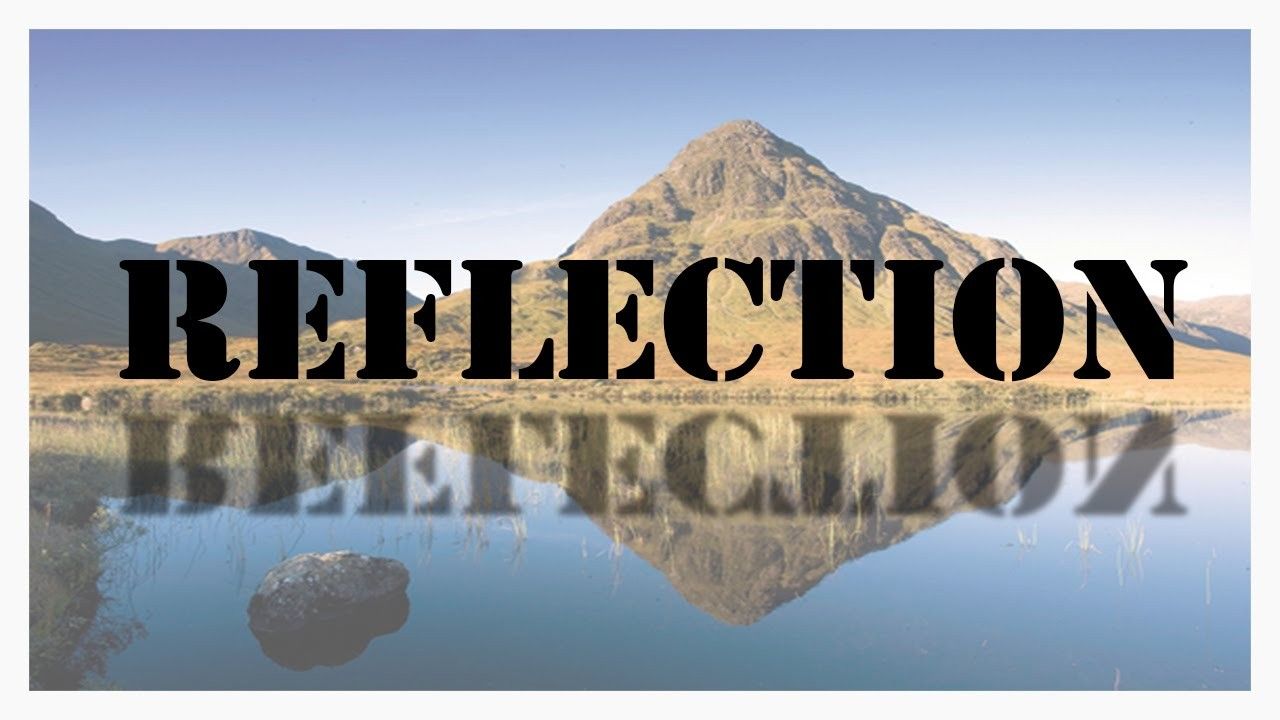 A reflection of a mountain in a body of water