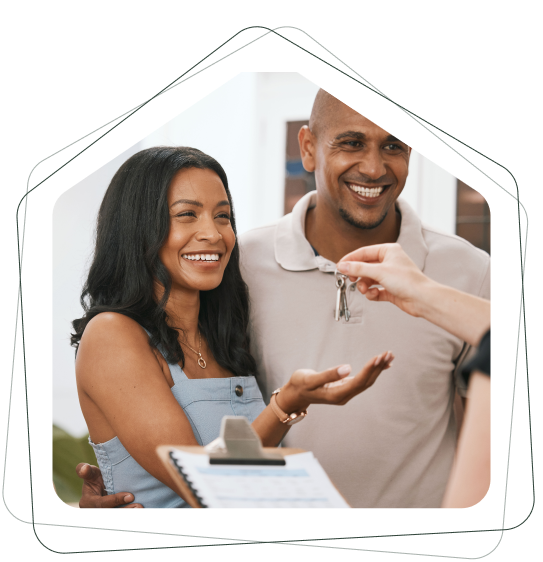 A man and a woman are getting keys to their new home.