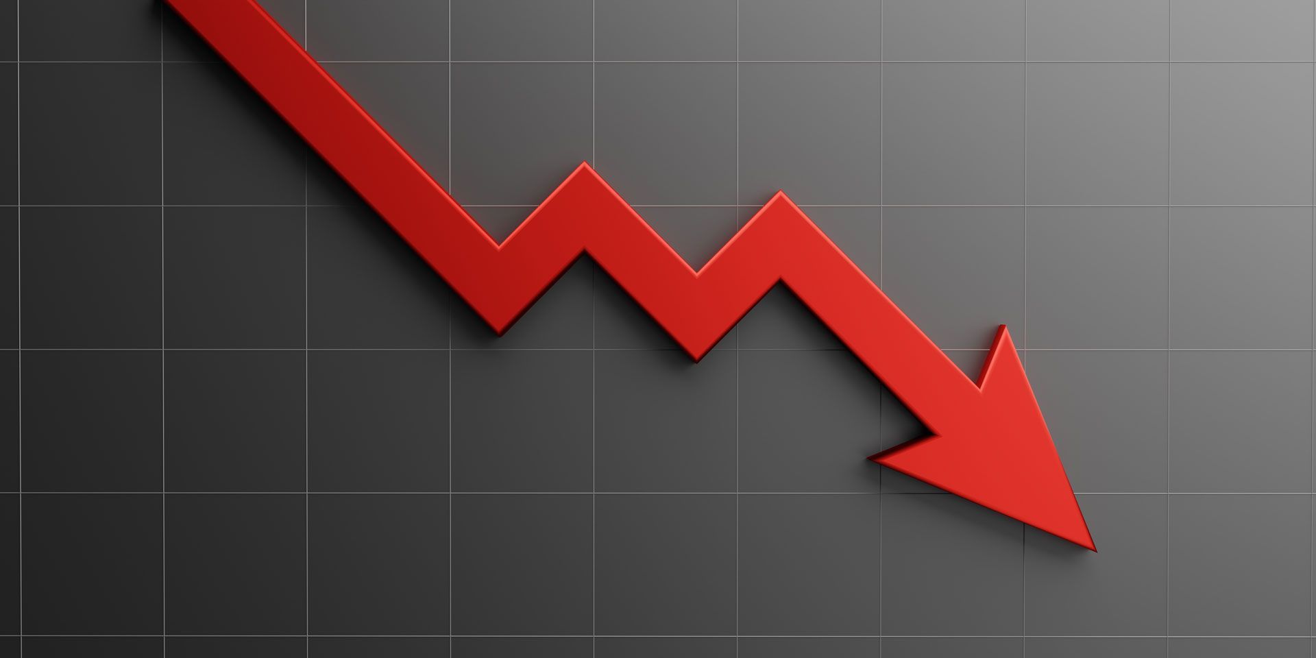 Red arrow pointing downward on a gray grid, indicating a decline.