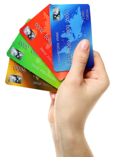 A person is holding four credit cards in their hand