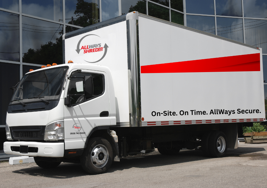 White box truck with red stripe, logo