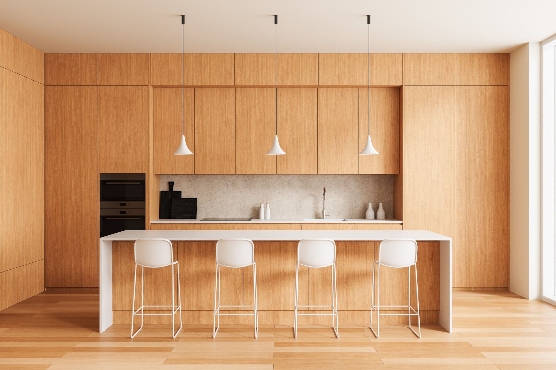 A modern kitchen with wooden cabinets and white counter tops and stools.