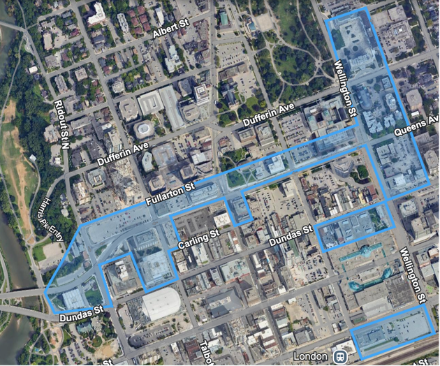 An aerial view of a city with a red outline around the buildings.