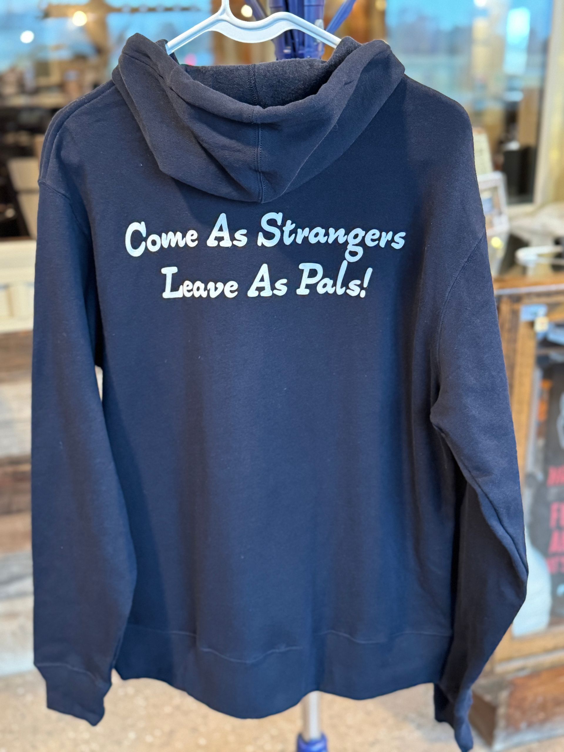 Navy blue zip-up hoodie with white drawstring and logo on the chest.