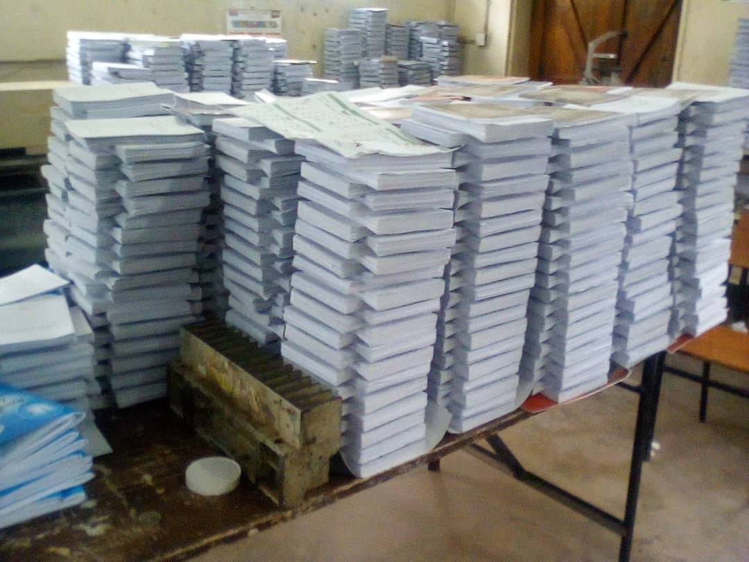 A stack of books sitting on top of a table.