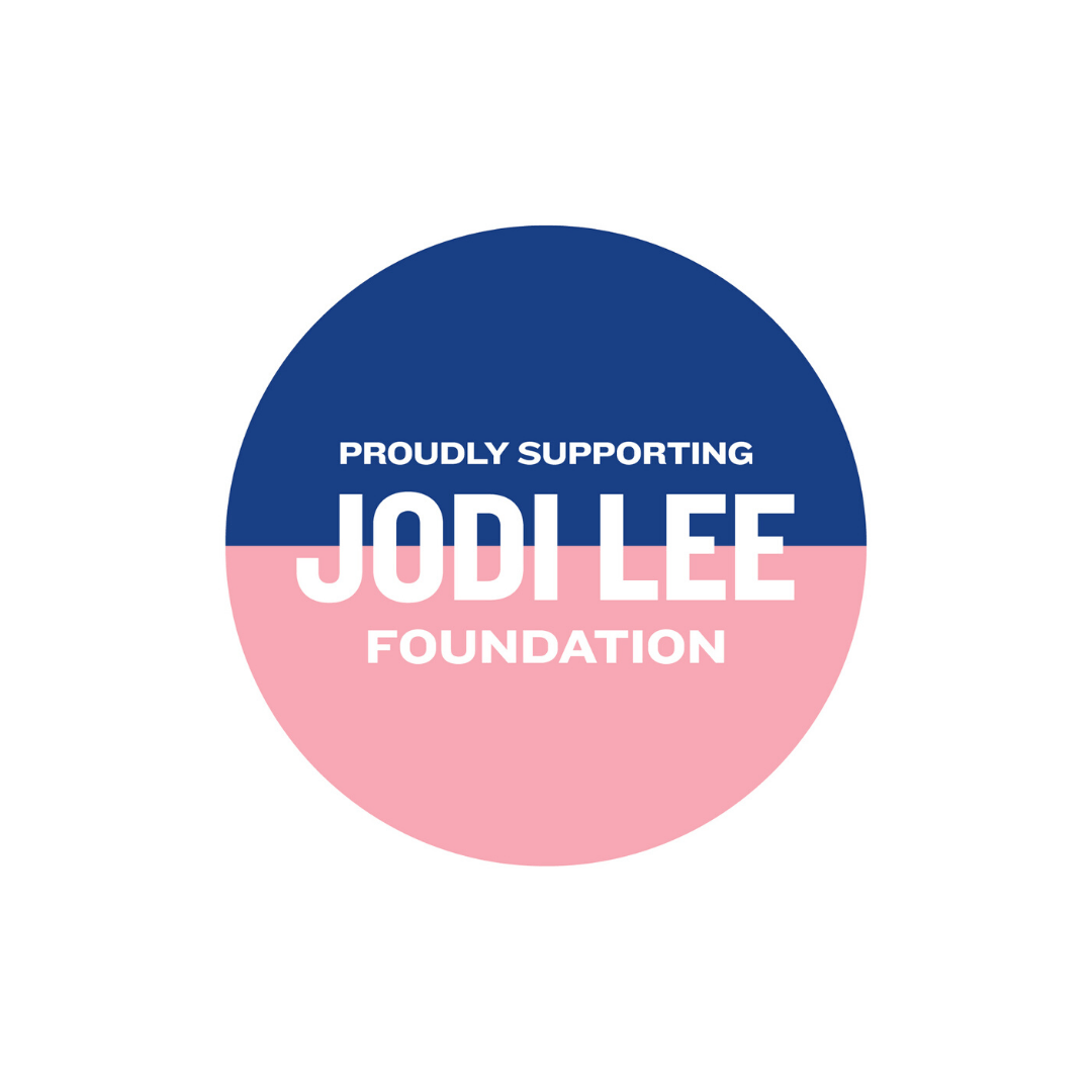 A circular logo with a navy blue top and light pink bottom, featuring the white text 