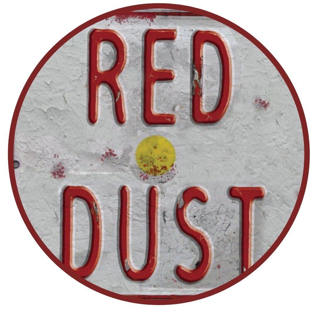 A circular sign with red, distressed text reading 