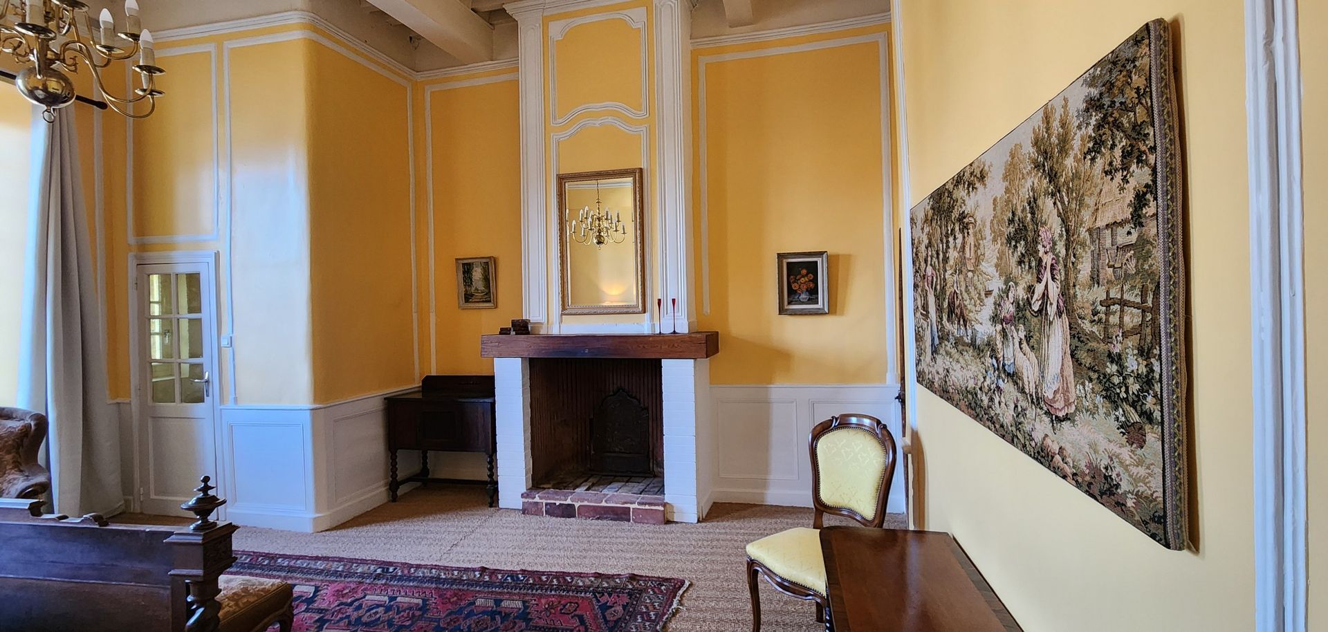 there is a fireplace in the middle of the room .