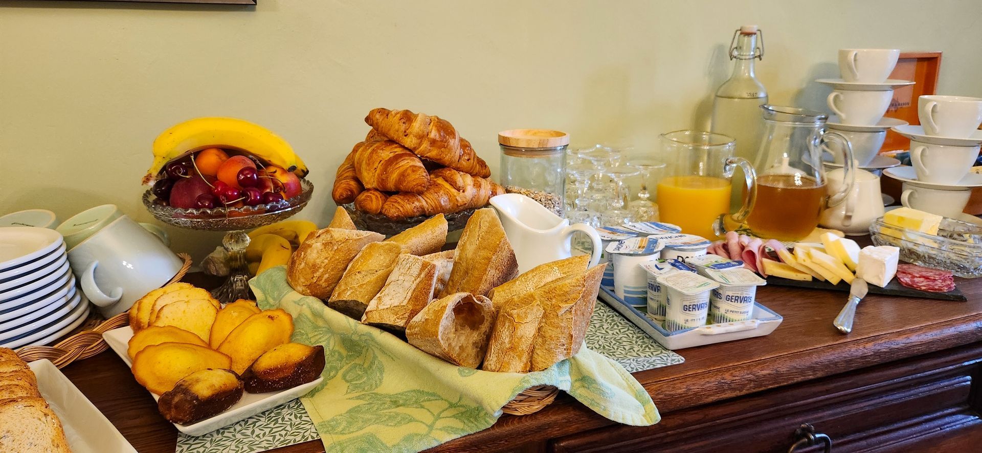 A table topped with a variety of food and drinks.