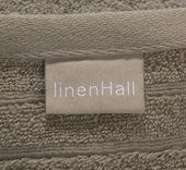 A custom towel with a linenHall brand label