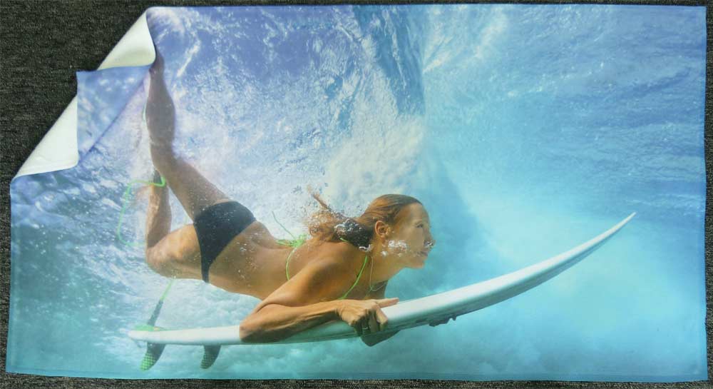 A Printed Towel with the Image of a Woman Surfing