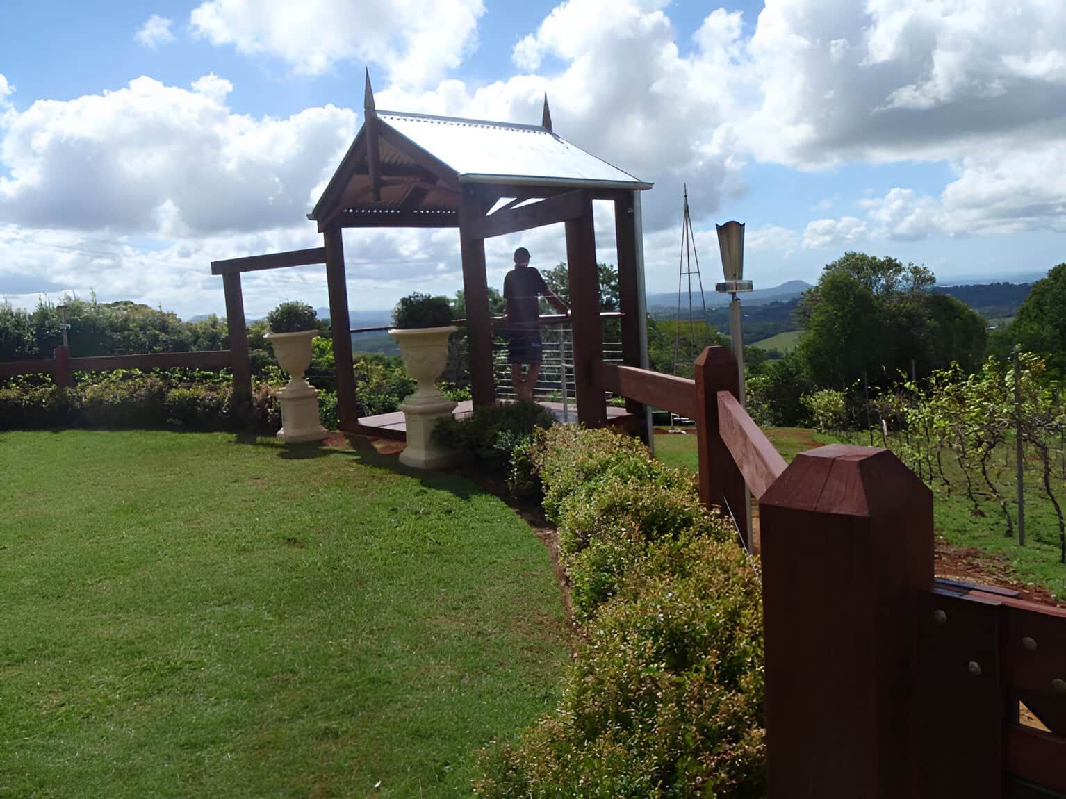 A Gazebo In The Middle Of A Lush Green Field — John Stark Fencing In Cooroy, QLD