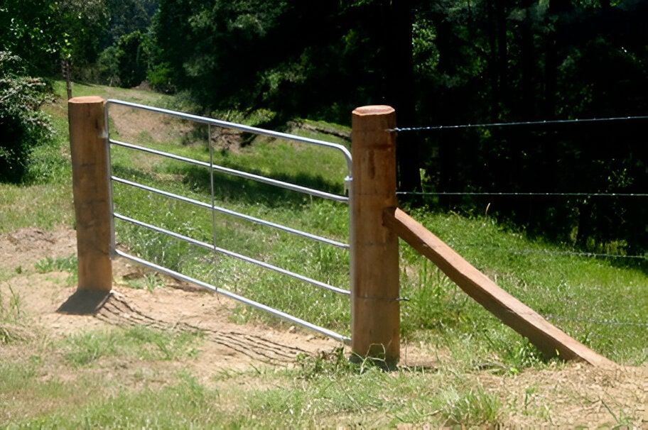 A Wooden Post With A Metal Gate Attached To It — John Stark Fencing In Cooroy, QLD