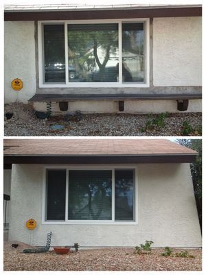 Exterior of house with a large window.