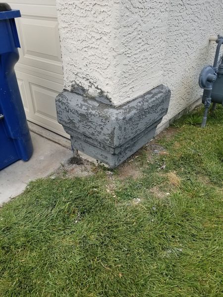 Gray corner molding on a stucco wall. 