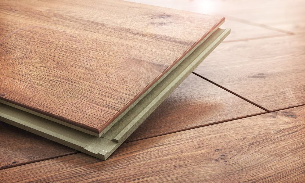 Two Pieces Of Wood Are Stacked On Top Of Each Other On A Wooden Floor — Affordable Carpets Woolgoolga In Coffs Harbour, NSW