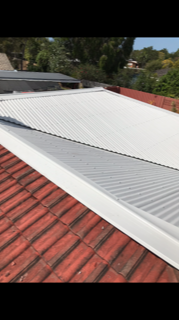 Roof Repair Using Hand Driller — Top Roof NQ in Townsville, QLD