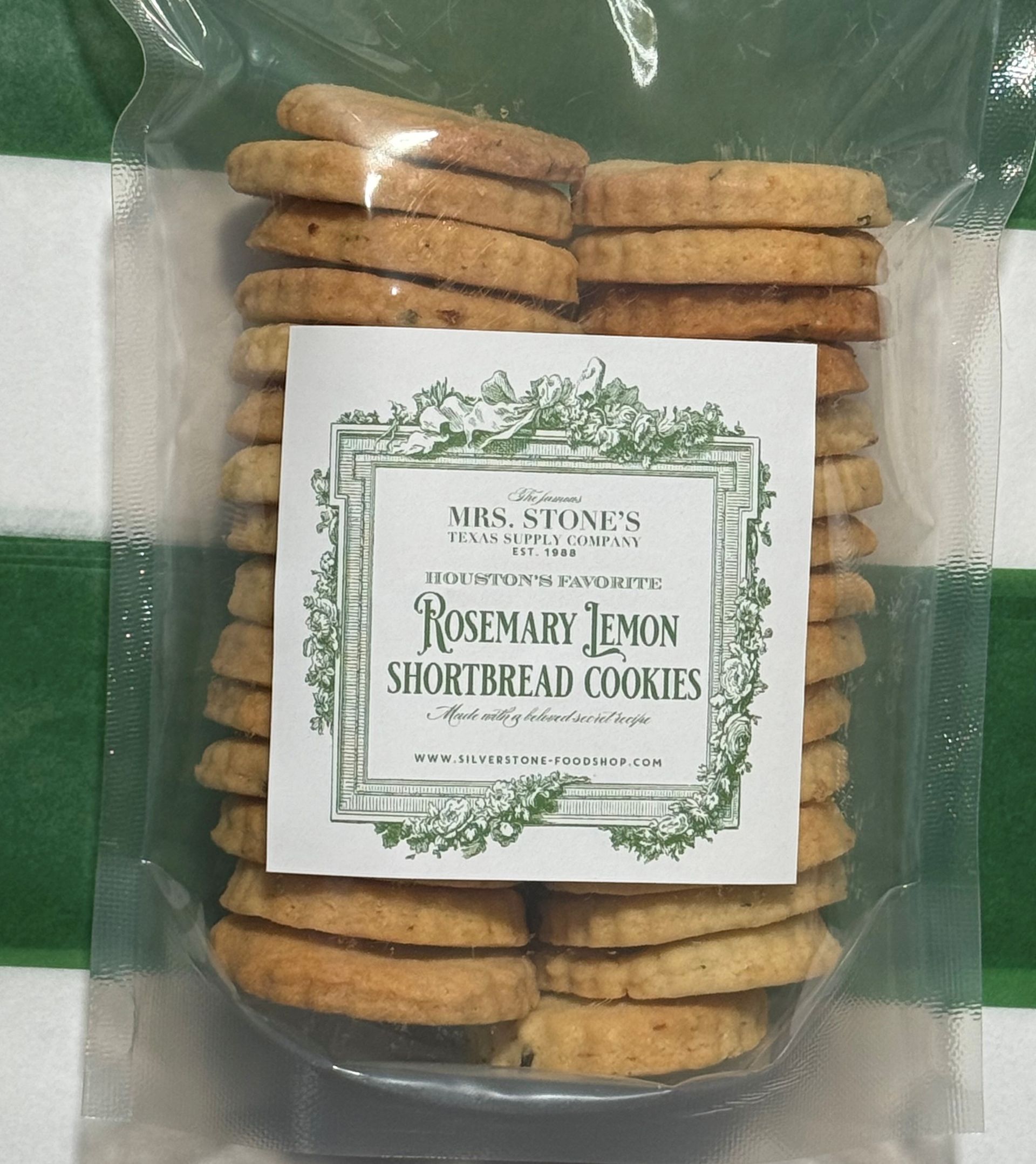 Package of rosemary lemon shortbread cookies, with label on a green and white striped background.