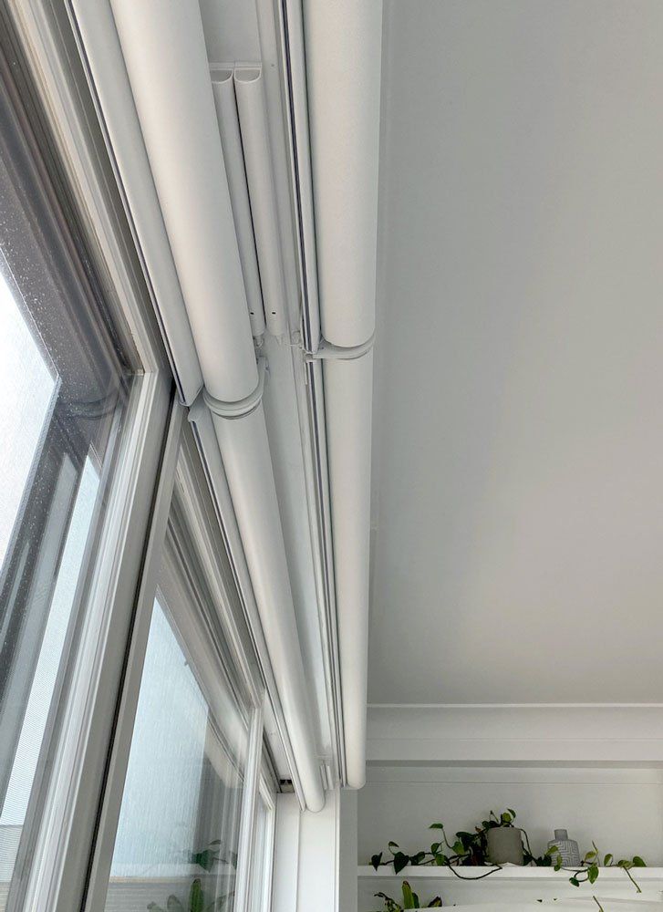 A white motorized blind