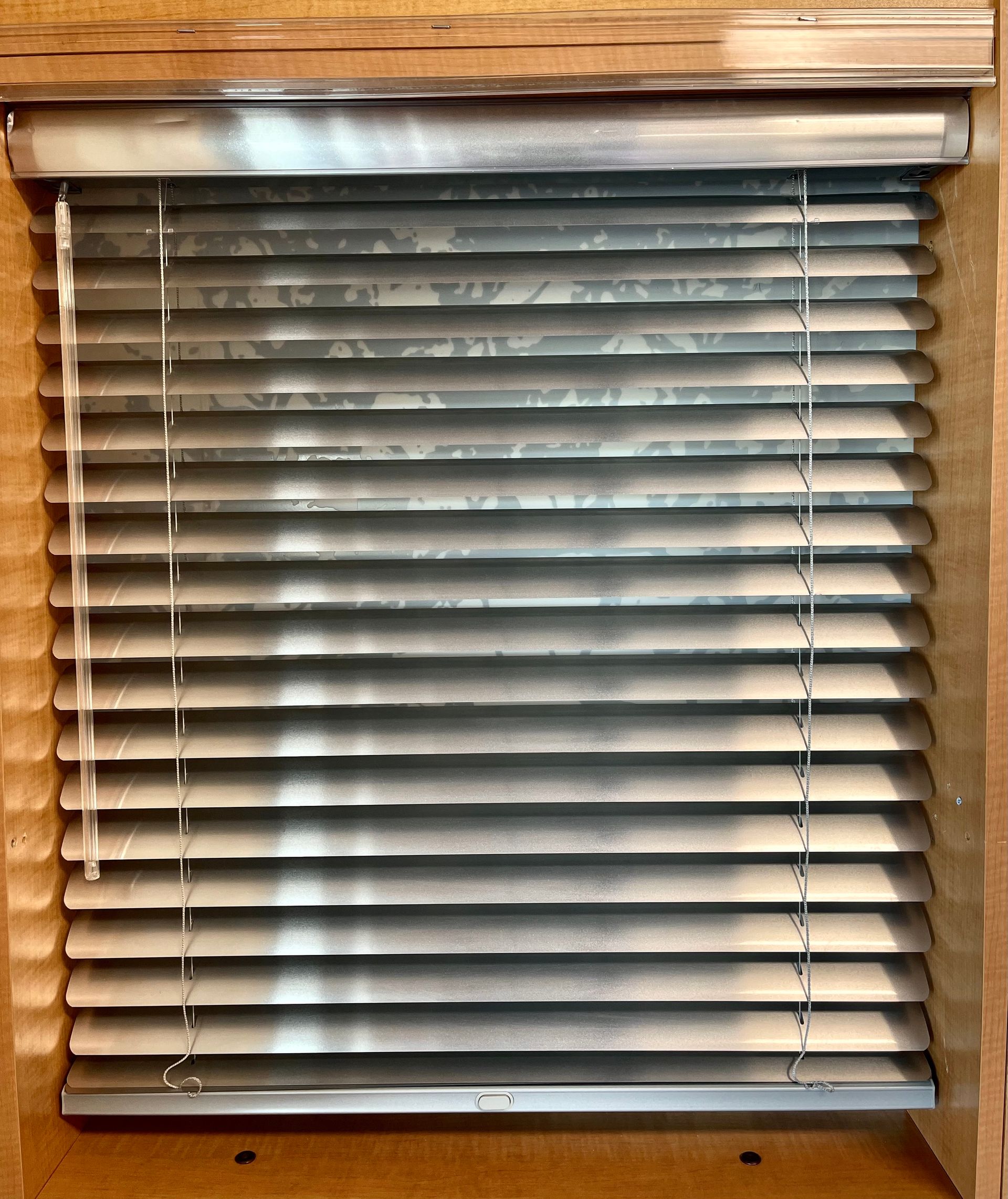 A close up of a window with blinds on it