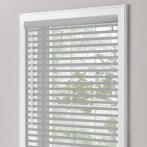 a close up of a window with blinds on it with wand tilt
