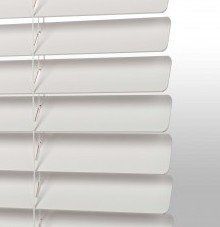 a close up of a white rounded corner blind on a white background .