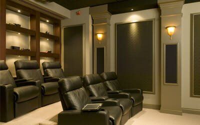 a home theater with blinds by Affordable Blind Pros.