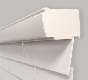 a close up of a white vertical blind on a window.
