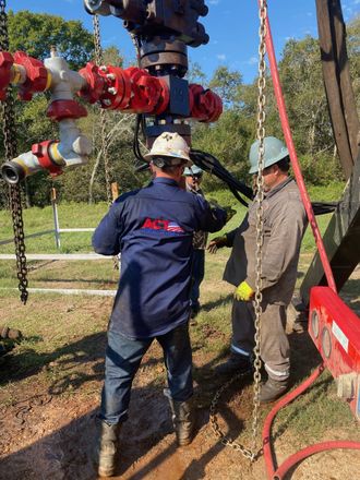 A group of men are working on an oil rig.
