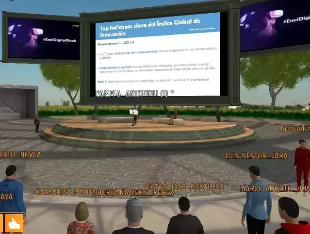 Virtual presentation: avatars on a stage with large screens displaying information; outdoor setting.